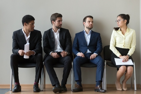 one woman among male applicants for job interview